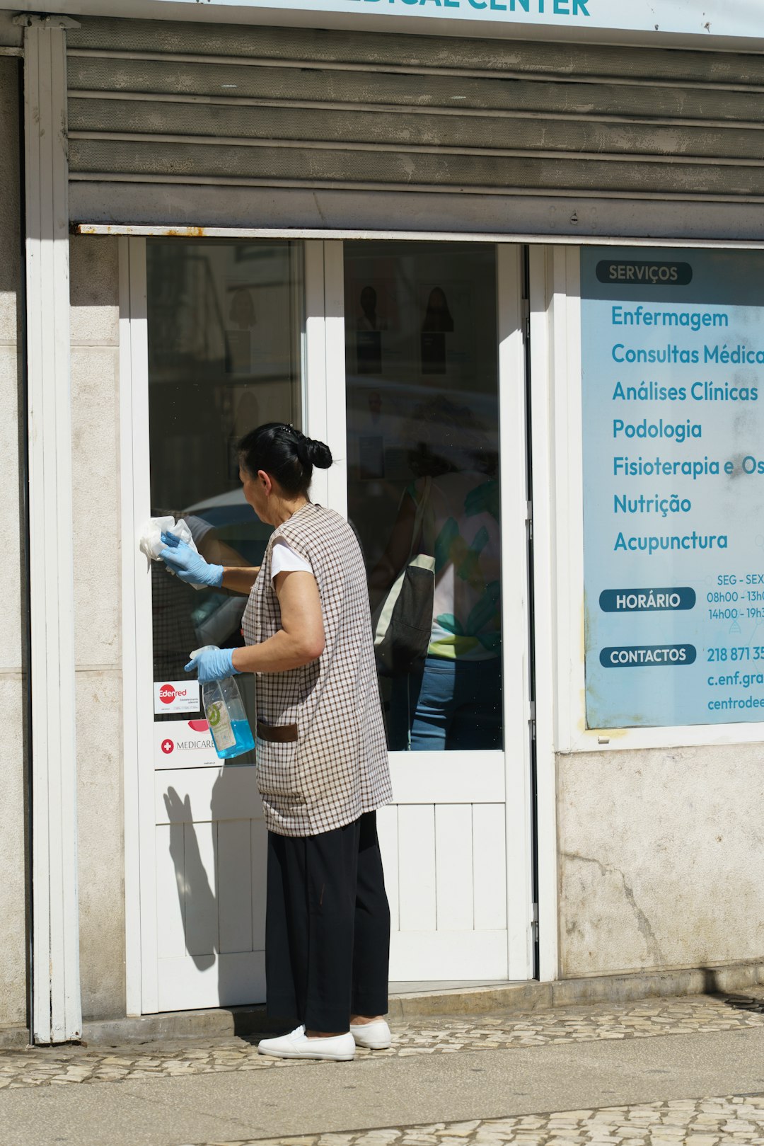 a-man-standing-outside-of-a-medical-center-ml-gkrgscdq